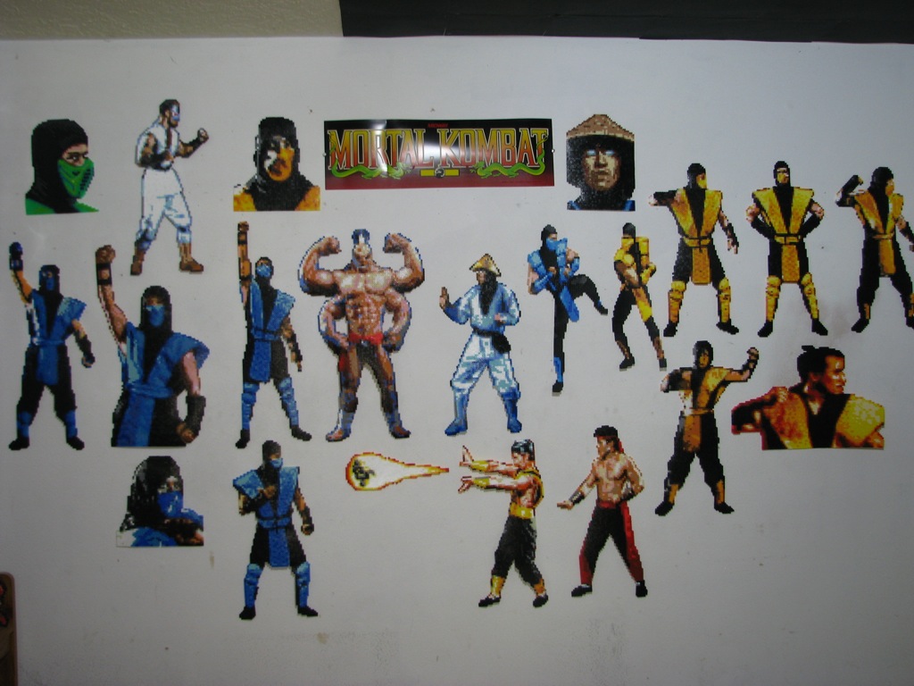 Kano (SNES), Goro(SNES), Rayden(SNES), Shang Tsung+fireball(Sega Genesis MKII), and UMK3 Sub-Zero VS Scorpion (both SNES) are the newer edition to my growing MK Perler Bead sprite collection.  I just took one last group shot before beginning my &quot;part 2&quot; of the collection.