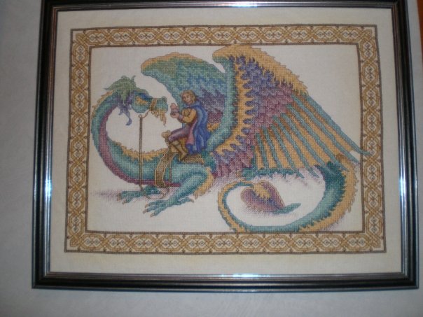 The rider in this one is done in whole stitches, but over one thread of cloth only, so four times smaller than the regular stitches on the dragon.